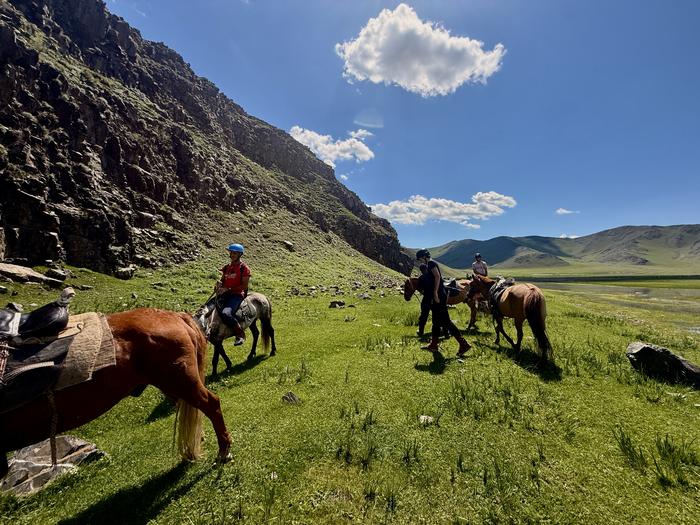 Riders in a rocky gorge